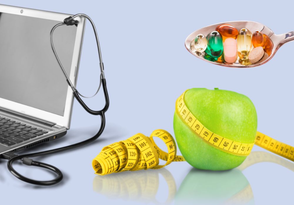 measuring tape, apple, stethoscope, laptop, vitamins