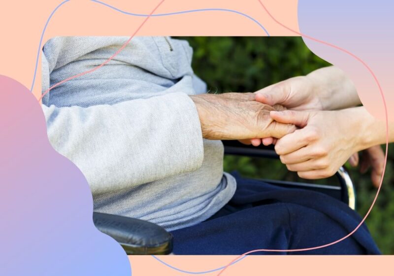 Graphic of holding hands with an elderly person in wheel chair
